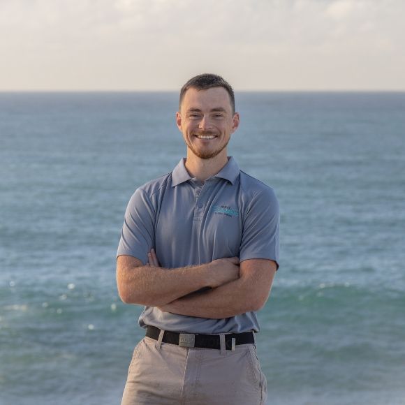 Mitch, Field Operations Manager at Mint Plumbing, by the ocean.