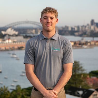 Finn, hardworking apprentice, with the vast ocean behind him.