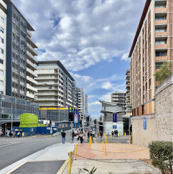 Urban environment in Mascot featuring modern developments and wide streets.