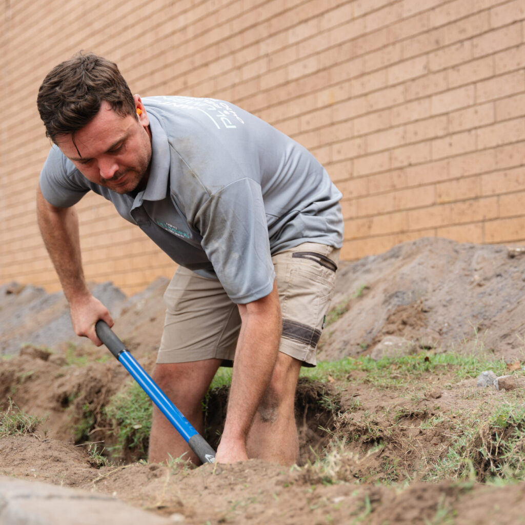 Digging a trench for sub soil drainage