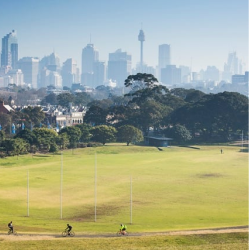 View of Queens Park with Sydney city skyline in the background.
