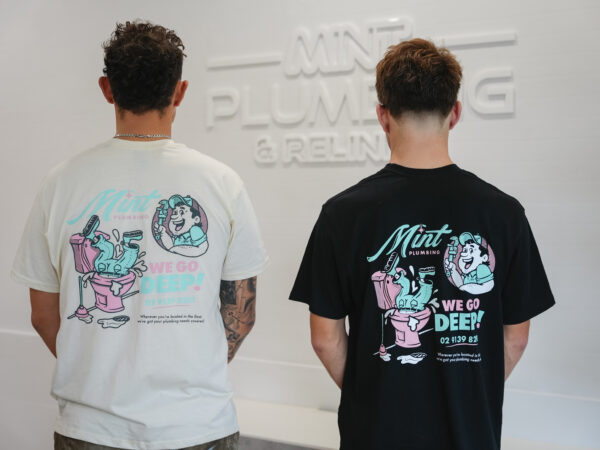 Two of the mint plumbing staff in our merch